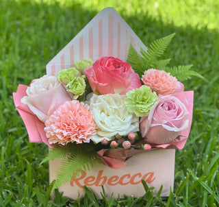 Blushing blooms custom signature arrangement